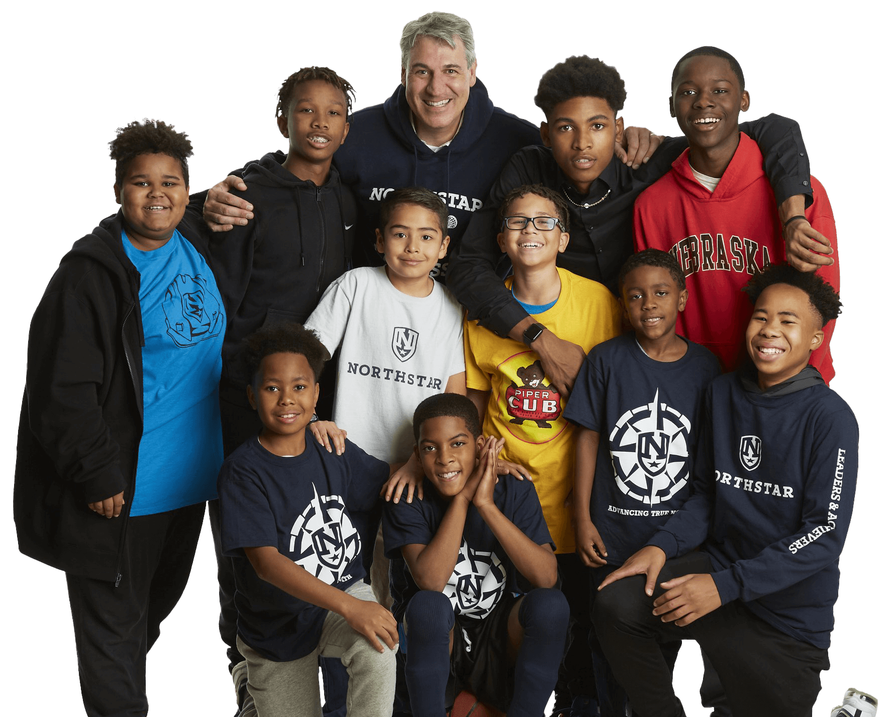 Scott Hazelrigg posing for photo with students from NorthStar Foundation
